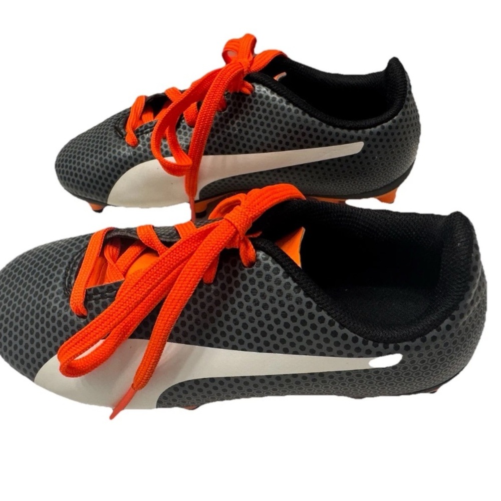 PUMA Kid’s Cleats in orange and black